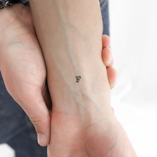 How can I personalize my F tattoo design
